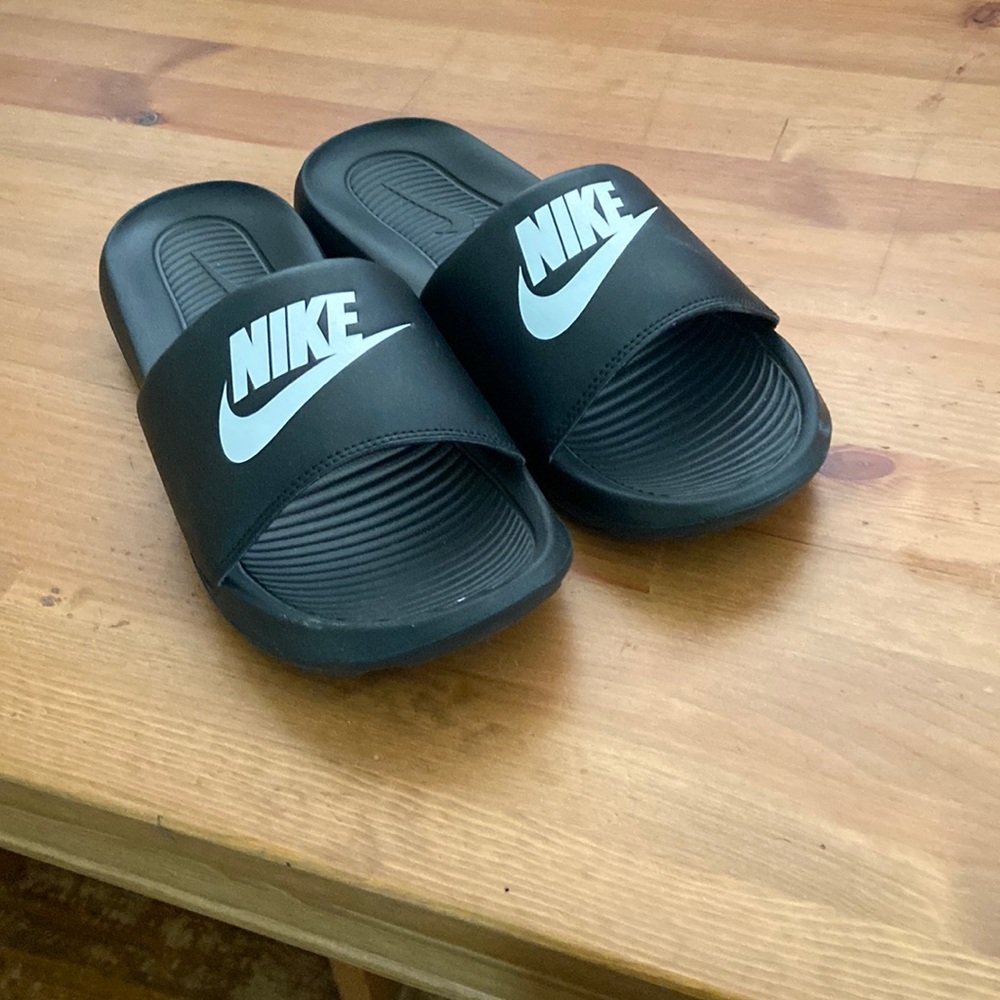 Women’s black Nike Slides. Size 9.